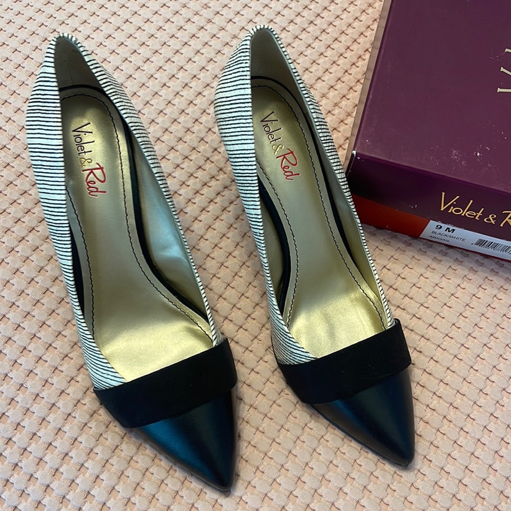 Like new black and white pumps